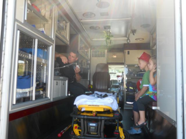 Lt. Brian Thompson shows the kids the pulse ox oin unit.